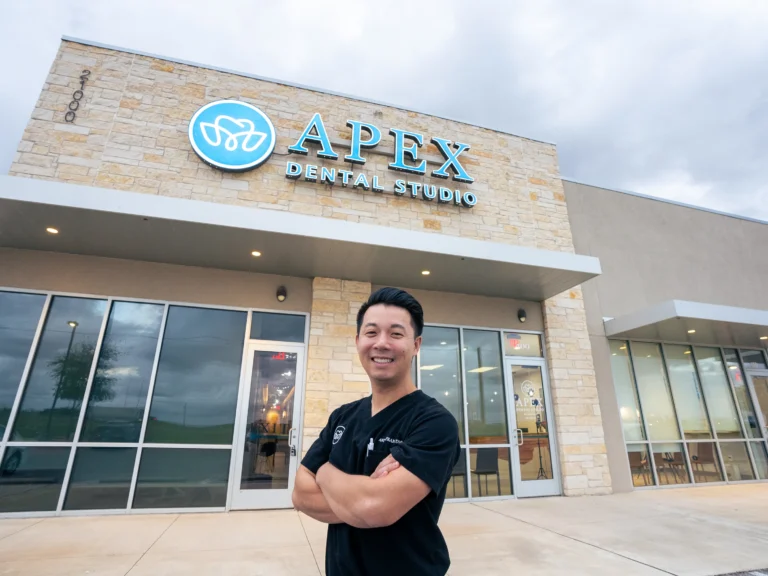 Top Rated Dentist in Hutto TX Dr Tran in front of Apex Dental Studio